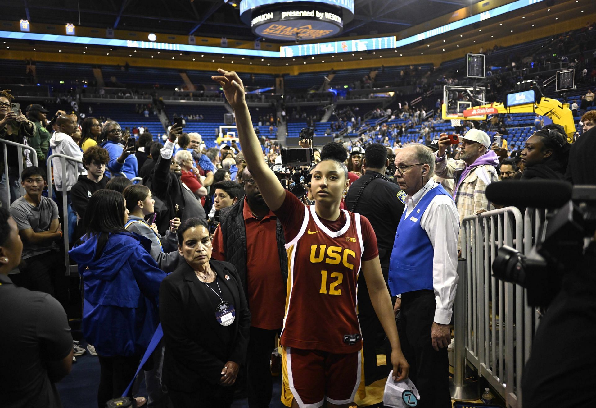 JuJu Watkins (#12) of the USC Trojans points toward the crowd after defeating the UCLA Bruins 80-67 to win the Big Ten regular-season title at Pauley Pavilion. Photo: Getty
